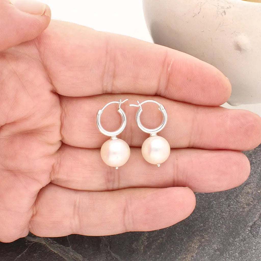 Get your Luminous Orb Natural White Oval Pearl Hoop Earring online now or in store at Forever Gems in Franschhoek, South Africa