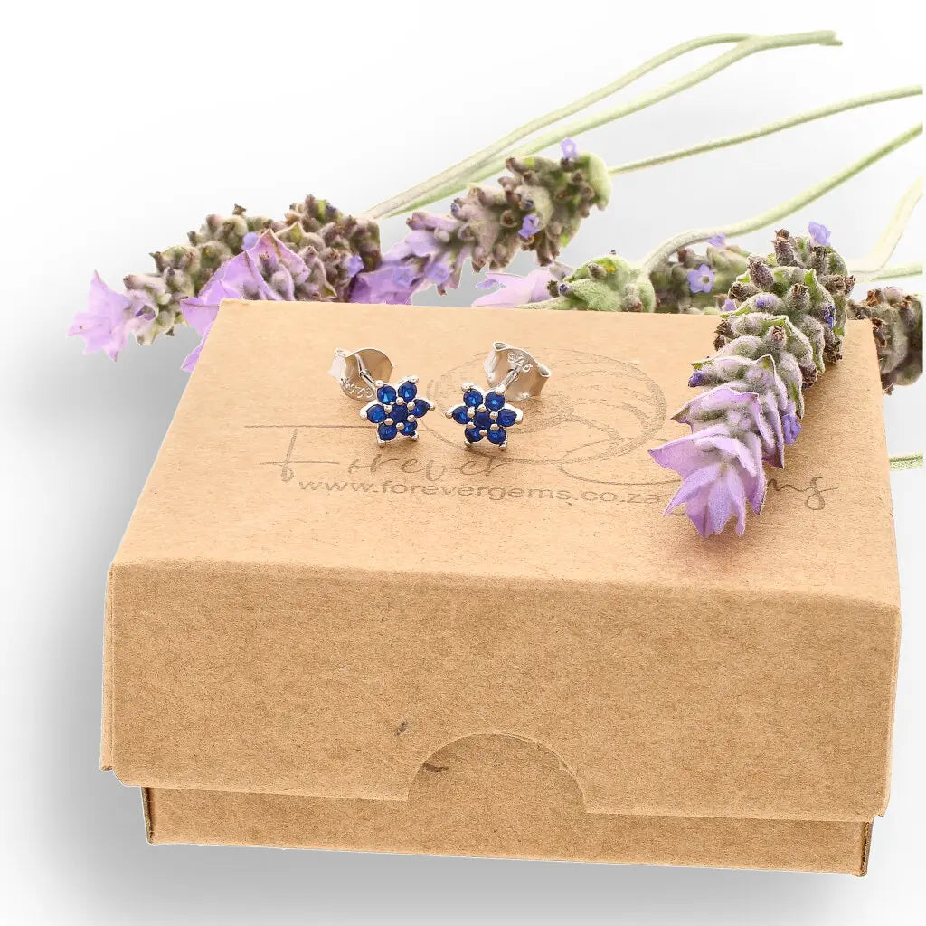Get your Petite Sterling Silver Blue CZ Flower Stud Earrings online now or in store at Forever Gems in Franschhoek, South Africa