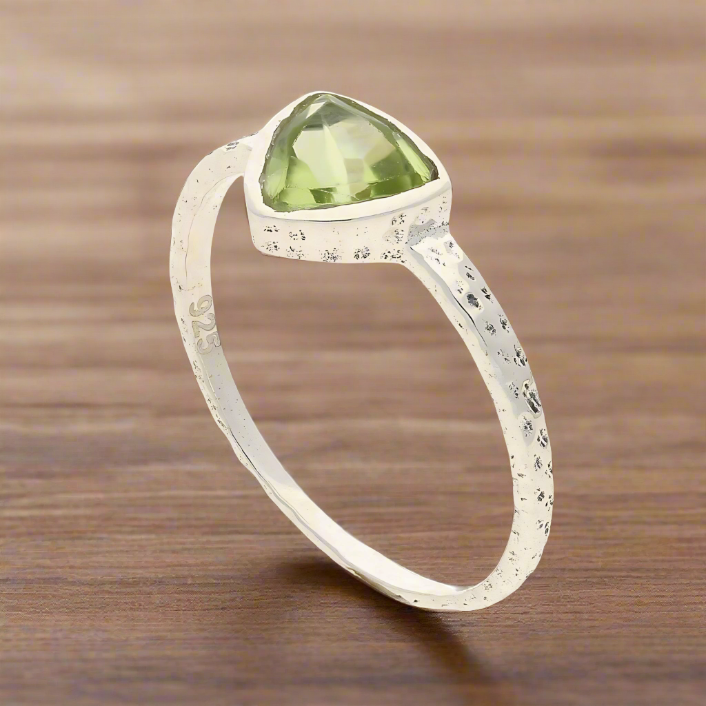 Get your Peridot Radiance: Trillion Spark Sterling Silver Ring online now or in store at Forever Gems in Franschhoek, South Africa