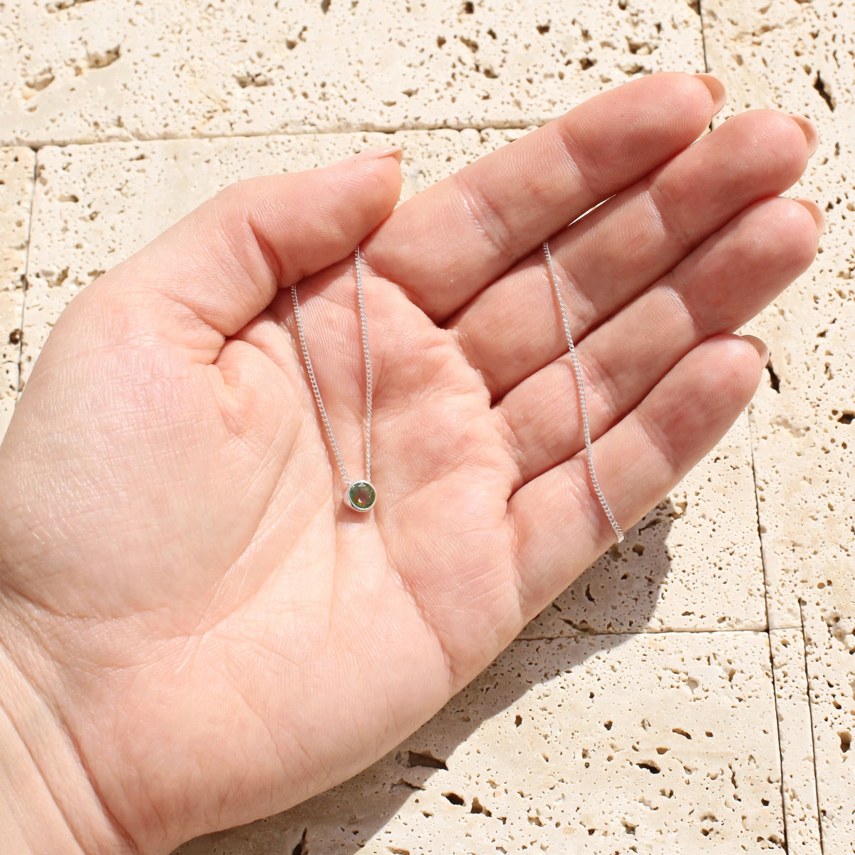 Get your Verdant Glow Natural Green Tourmaline Tube Set Slider Necklace online now or in store at Forever Gems in Franschhoek, South Africa