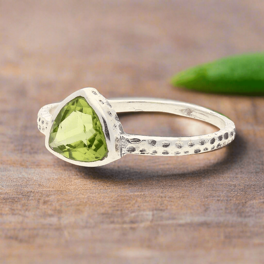 Get your Peridot Radiance: Trillion Spark Sterling Silver Ring online now or in store at Forever Gems in Franschhoek, South Africa