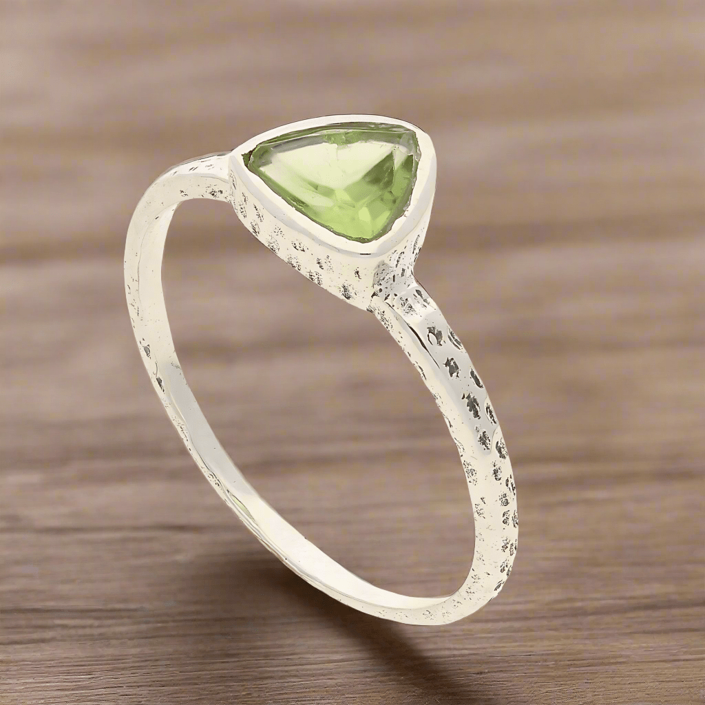 Get your Peridot Radiance: Trillion Spark Sterling Silver Ring online now or in store at Forever Gems in Franschhoek, South Africa