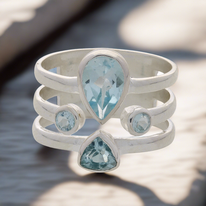 Buy your Triple Band Sterling Silver Ring with Cascading Blue Topaz Quartet online now or in store at Forever Gems in Franschhoek, South Africa