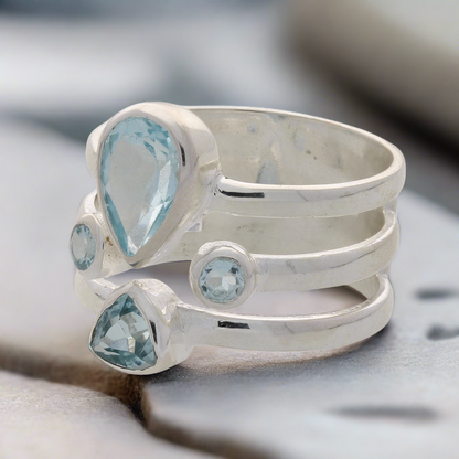 Buy your Triple Band Sterling Silver Ring with Cascading Blue Topaz Quartet online now or in store at Forever Gems in Franschhoek, South Africa