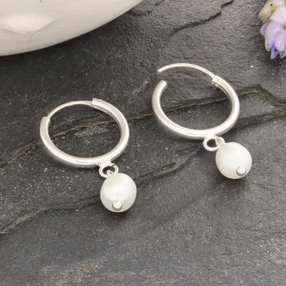 Get your Pearl Drift Natural White Oval Pearl Hoop Earrings online now or in store at Forever Gems in Franschhoek, South Africa