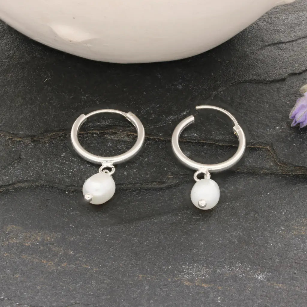 Get your Pearl Drift Natural White Oval Pearl Hoop Earrings online now or in store at Forever Gems in Franschhoek, South Africa