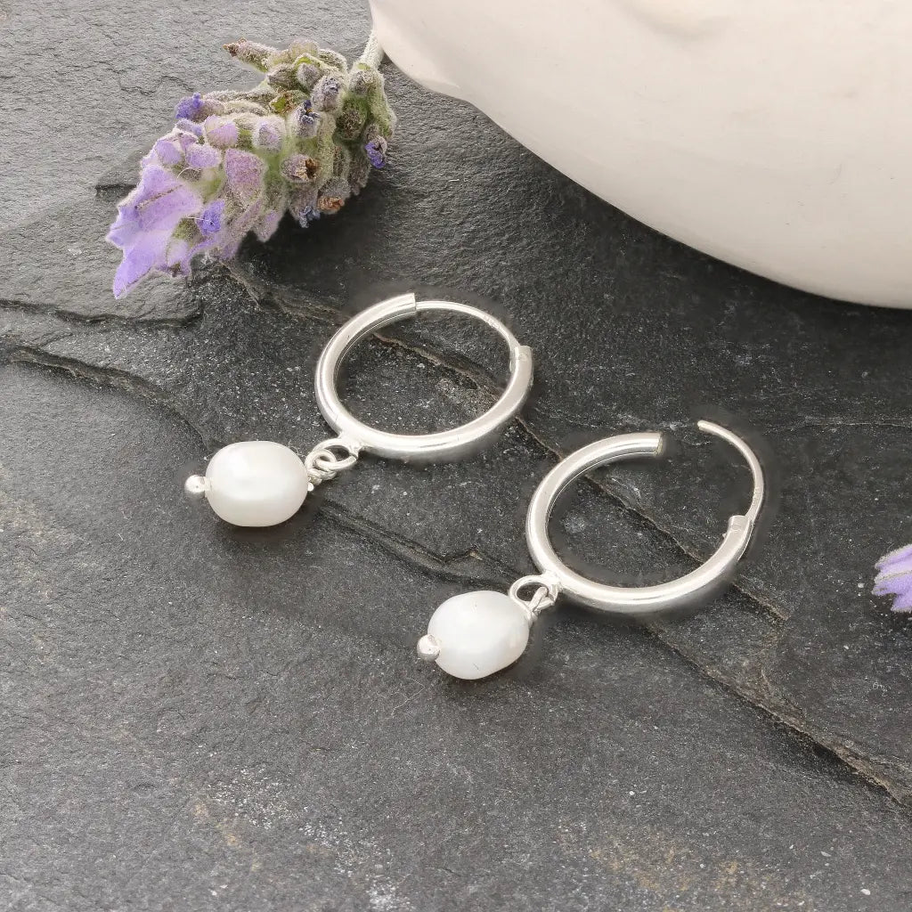 Get your Pearl Drift Natural White Oval Pearl Hoop Earrings online now or in store at Forever Gems in Franschhoek, South Africa