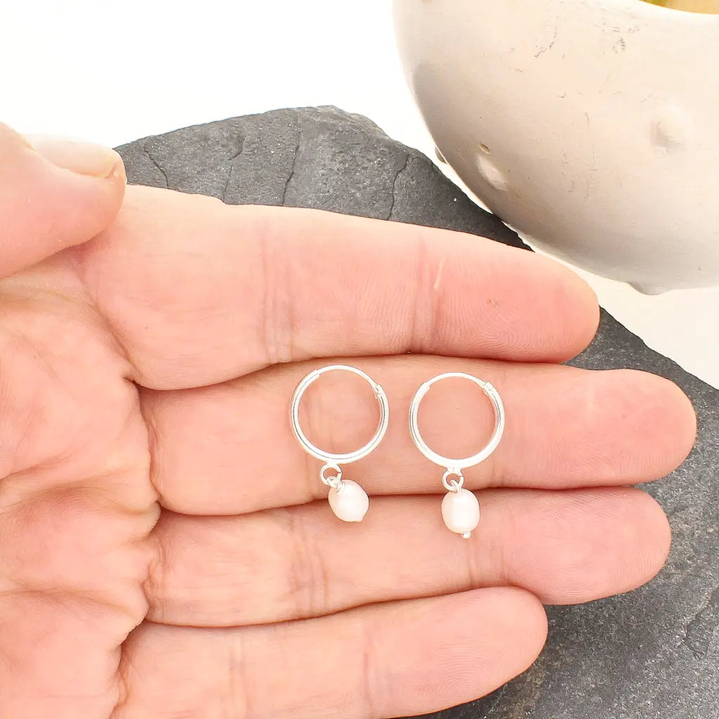 Get your Pearl Drift Natural White Oval Pearl Hoop Earrings online now or in store at Forever Gems in Franschhoek, South Africa