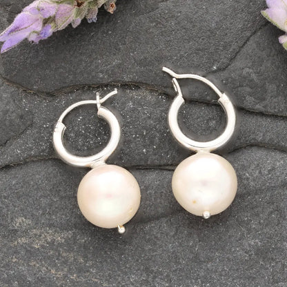 Get your Luminous Orb Natural White Oval Pearl Hoop Earring online now or in store at Forever Gems in Franschhoek, South Africa