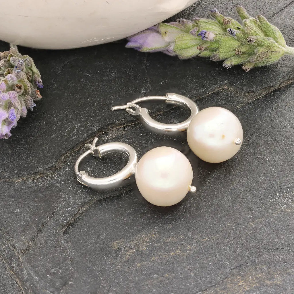 Get your Luminous Orb Natural White Oval Pearl Hoop Earring online now or in store at Forever Gems in Franschhoek, South Africa