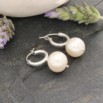 Get your Luminous Orb Natural White Oval Pearl Hoop Earring online now or in store at Forever Gems in Franschhoek, South Africa