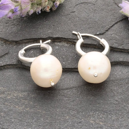 Get your Luminous Orb Natural White Oval Pearl Hoop Earring online now or in store at Forever Gems in Franschhoek, South Africa