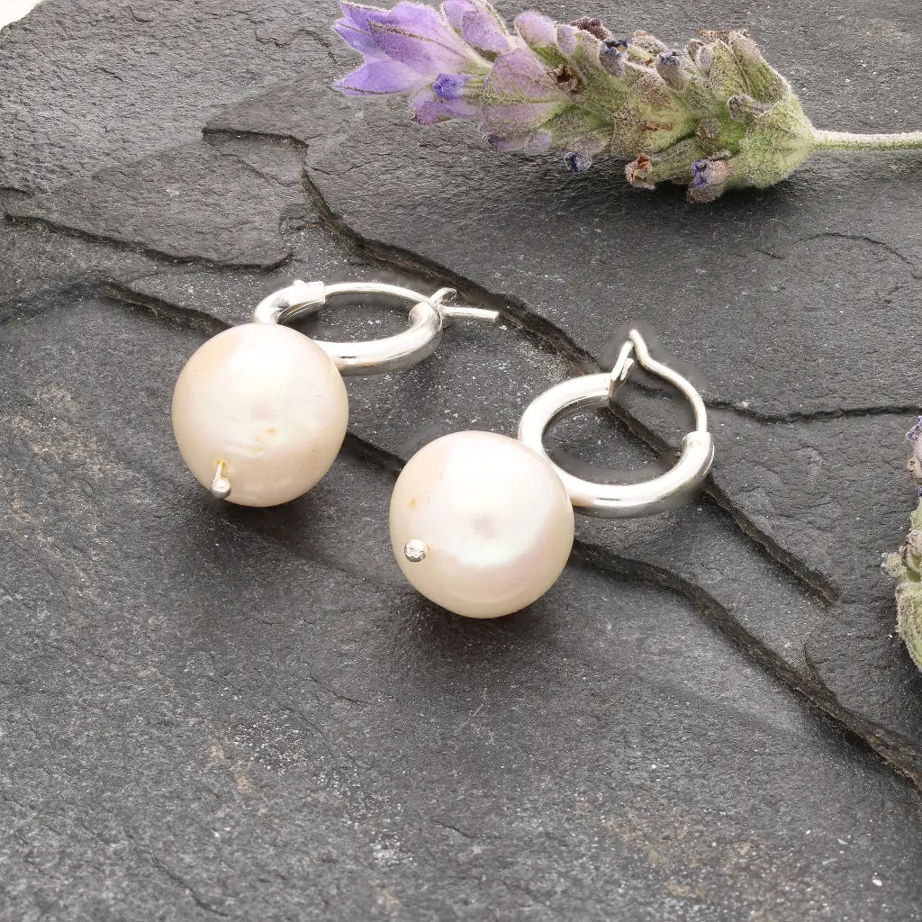 Get your Luminous Orb Natural White Oval Pearl Hoop Earring online now or in store at Forever Gems in Franschhoek, South Africa