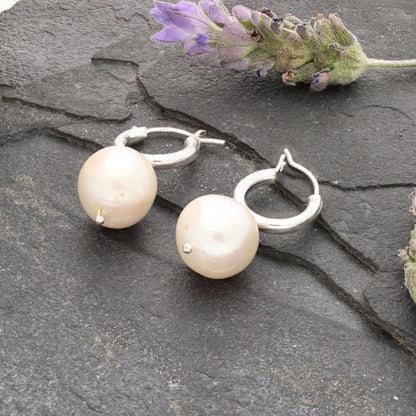 Get your Luminous Orb Natural White Oval Pearl Hoop Earring online now or in store at Forever Gems in Franschhoek, South Africa