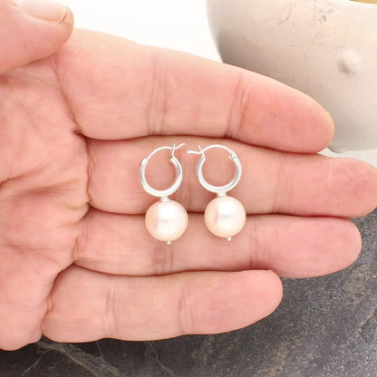 Get your Luminous Orb Natural White Oval Pearl Hoop Earring online now or in store at Forever Gems in Franschhoek, South Africa
