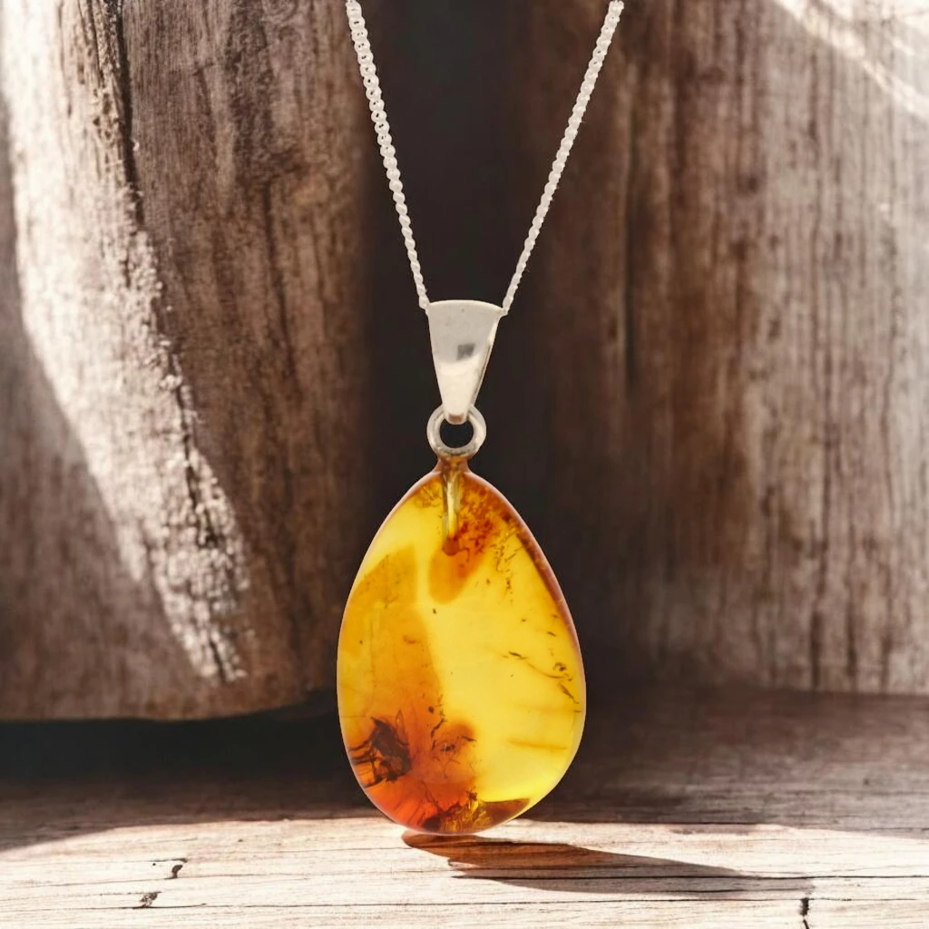 Get your Golden Time Capsule: Baltic Amber Insect Necklace in Silver online now or in store at Forever Gems in Franschhoek, South Africa