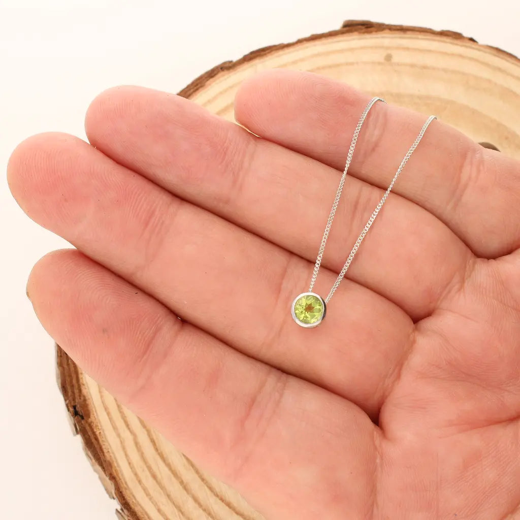 Get your Peridot Tube Set Slider Necklace online now or in store at Forever Gems in Franschhoek, South Africa