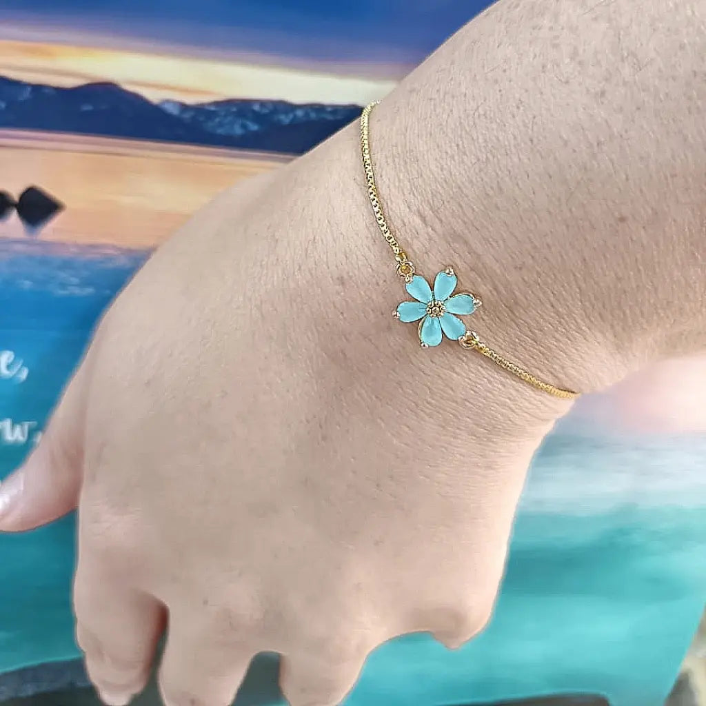 Get your Ocean Bloom Blue Flower Gold Plated Bracelet online now or in store at Forever Gems in Franschhoek, South Africa
