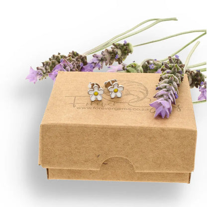 Get your Sterling Silver White Enamel Daisy Flower Stud Earrings 7mm online now or in store at Forever Gems in Franschhoek, South Africa