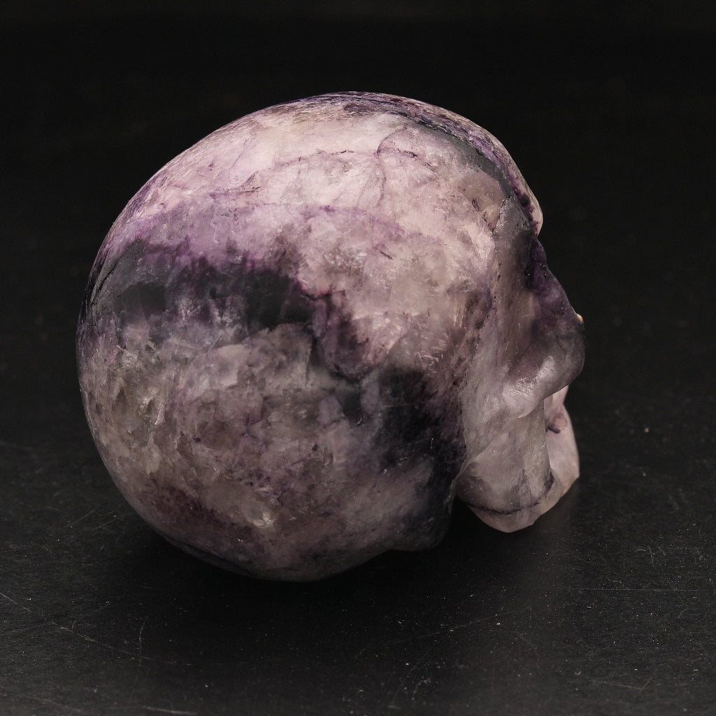 Buy your Blissful Purple Wisdom Fluorite Crystal Skull online now or in store at Forever Gems in Franschhoek, South Africa