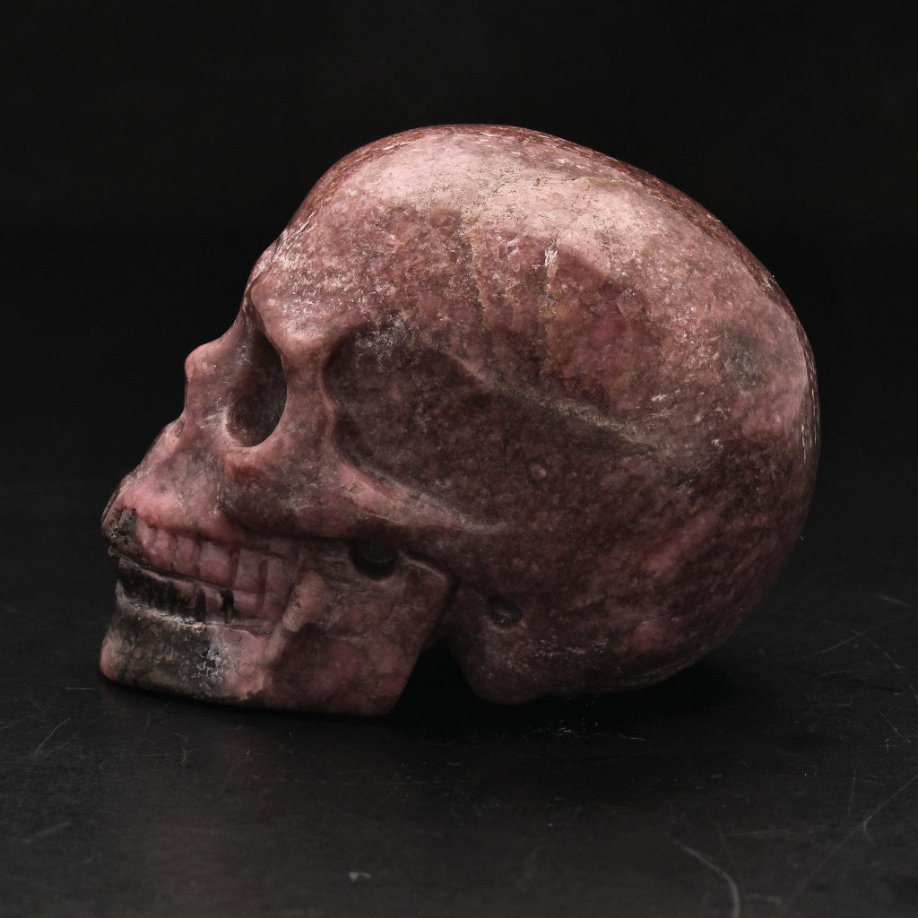 Buy your Pink Guardian Rhodonite Crystal Skull online now or in store at Forever Gems in Franschhoek, South Africa